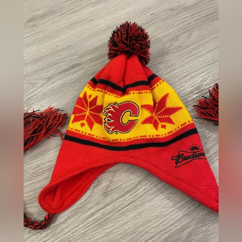 Calgary Flames NHL Hockey Budweiser Red Yellow Toque with Ear flaps & Poms.